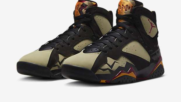 View of black and olive Air Jordan shoes.